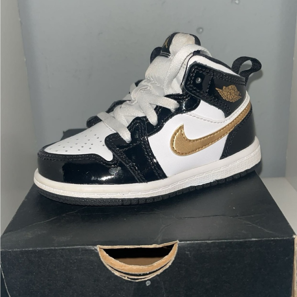 Jordan Black and Gold High-Top Sneakers